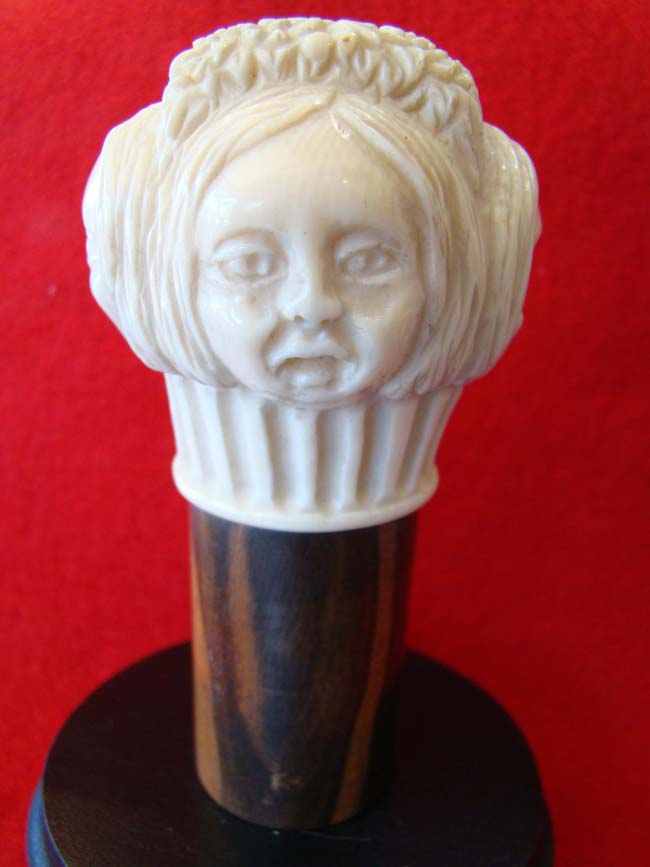 A rare carved four sided ivory knob from a cane with each side depicting the face of a woman with a different expressions. American circa 1850-1875 — image 3